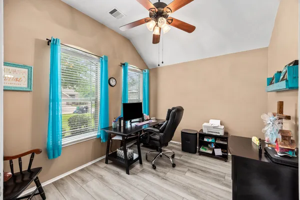 a workspace with furniture and a window