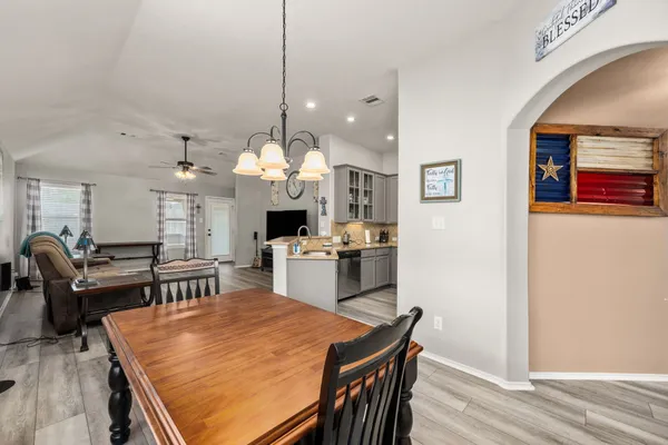 a large kitchen with lots of counter space and stainless steel appliances