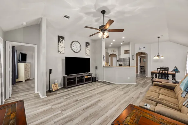 a living room with furniture and a flat screen tv