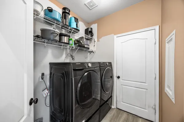 a utility room with dryer and washer