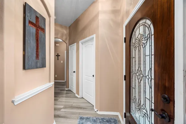 a view of front door with wooden floor