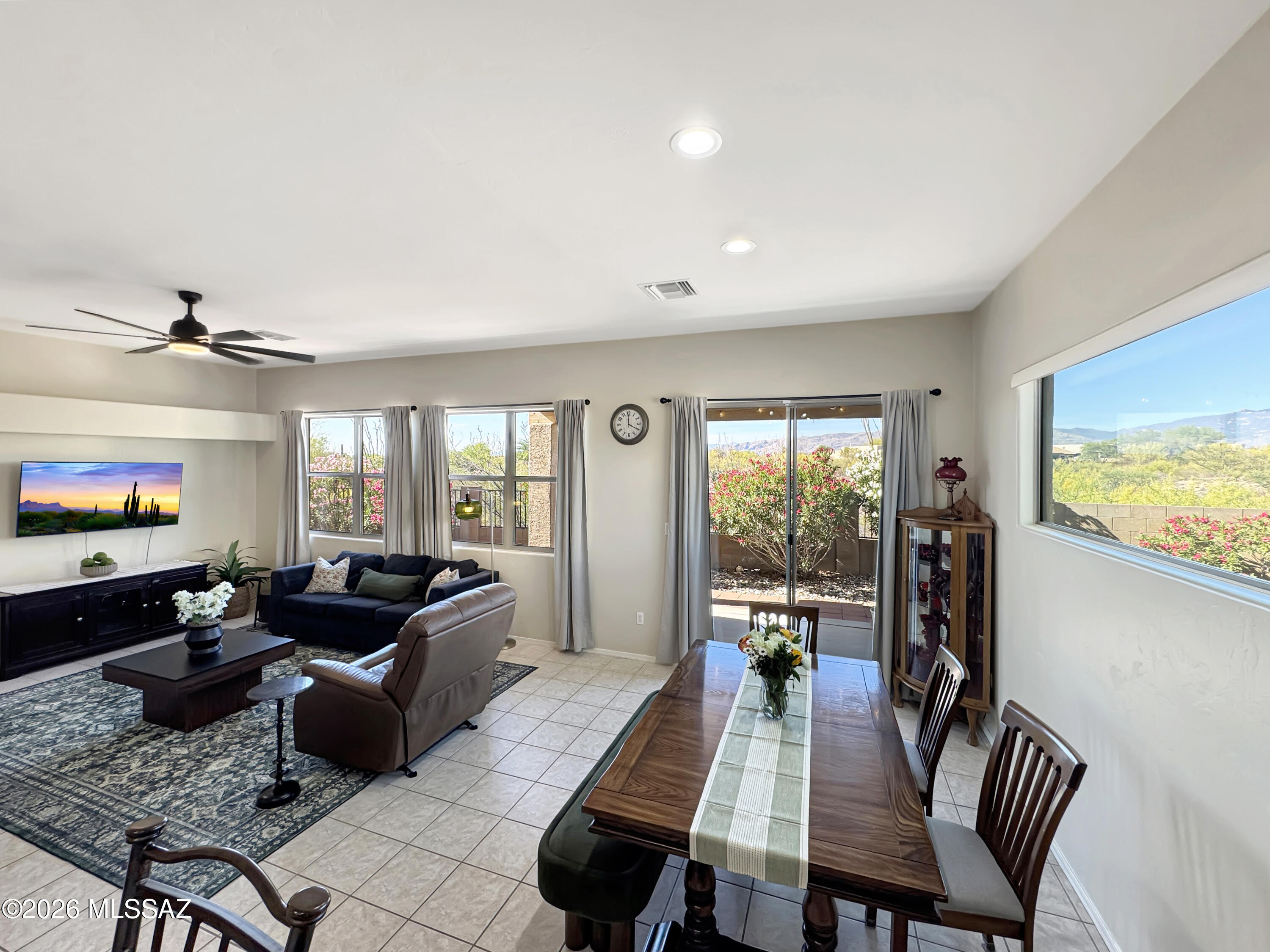 10835 South Heart Break Ridge Place Vail, AZ 85641 - Photo 18 of 49 a living room with furniture flat screen tv and a large window