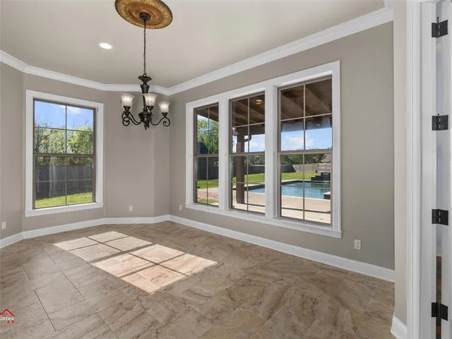 a living room with furniture and a ceiling fan