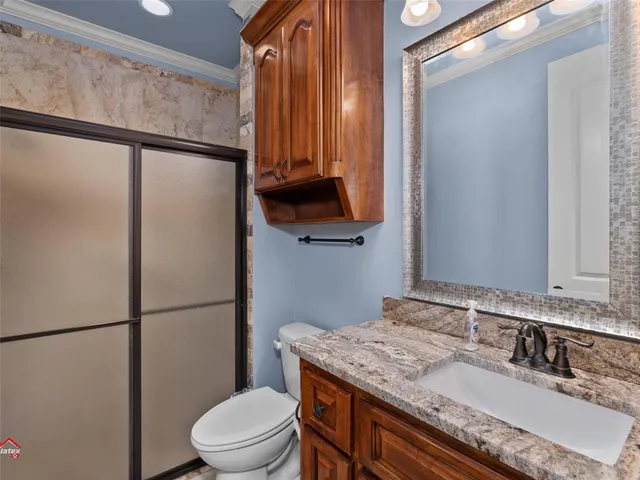 a view of hallway with window and hardwood