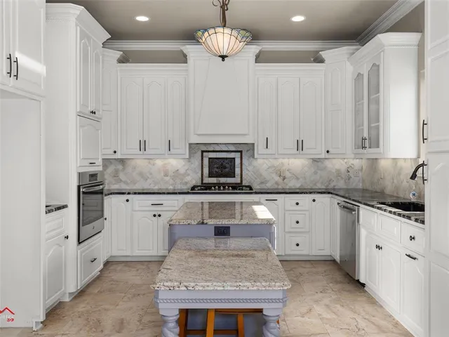 a kitchen with granite countertop a sink and a stove
