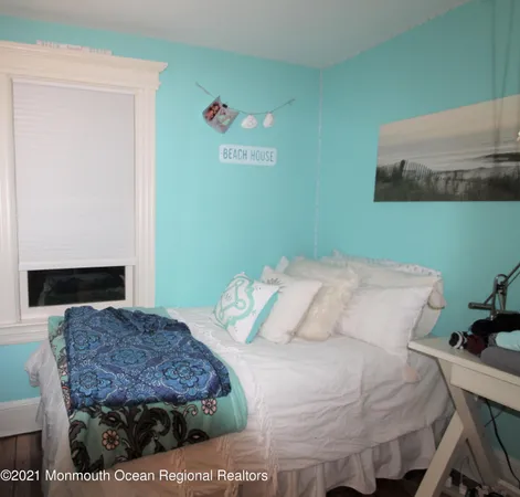 a bedroom with a bed and dresser