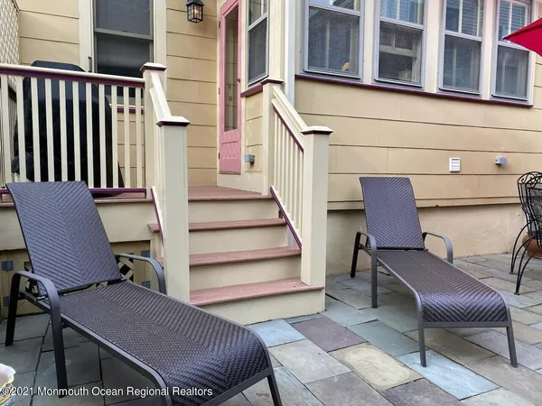 a view of two chairs in the balcony