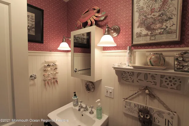 a bathroom with a sink and mirror