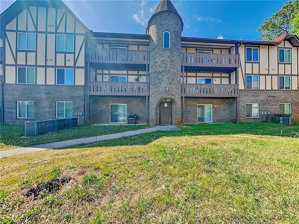 1020 Camelot Drive Atlanta, GA 30349 - Photo 1 of 17 a view of a brick building next to a yard