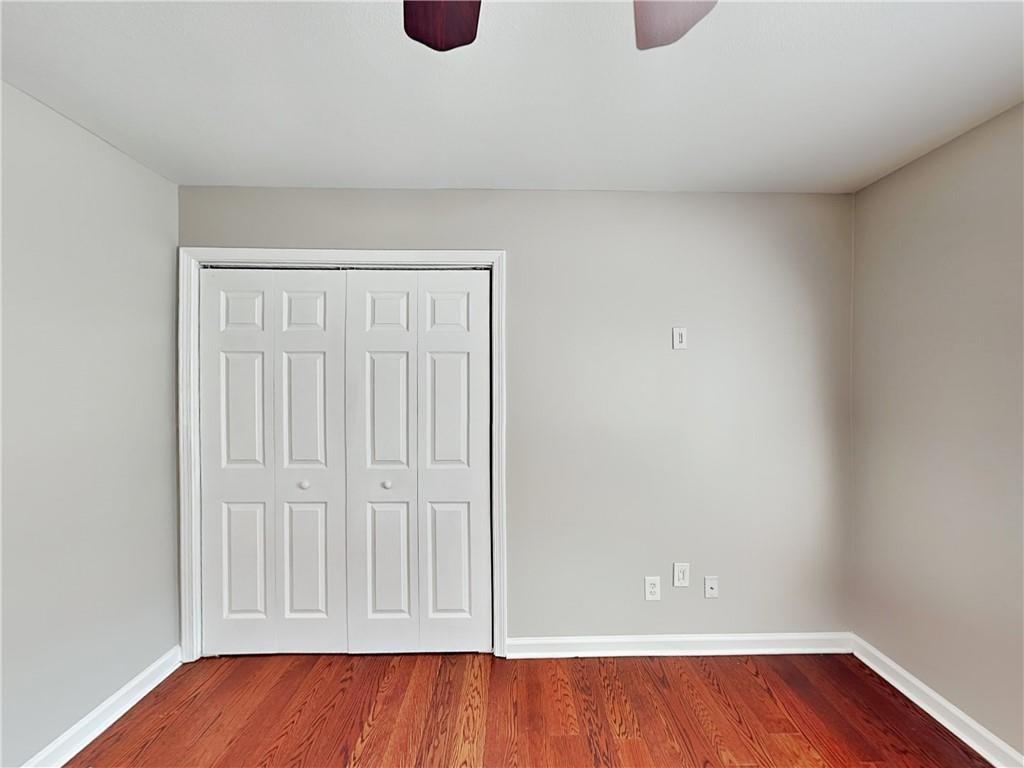 1020 Camelot Drive Atlanta, GA 30349 - Photo 14 of 17 a view of an empty room and wooden floor