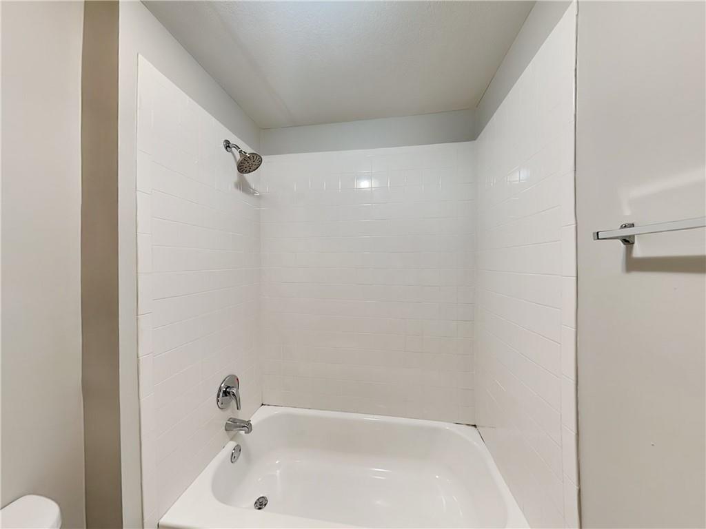 1020 Camelot Drive Atlanta, GA 30349 - Photo 16 of 17 a bathroom with a tub