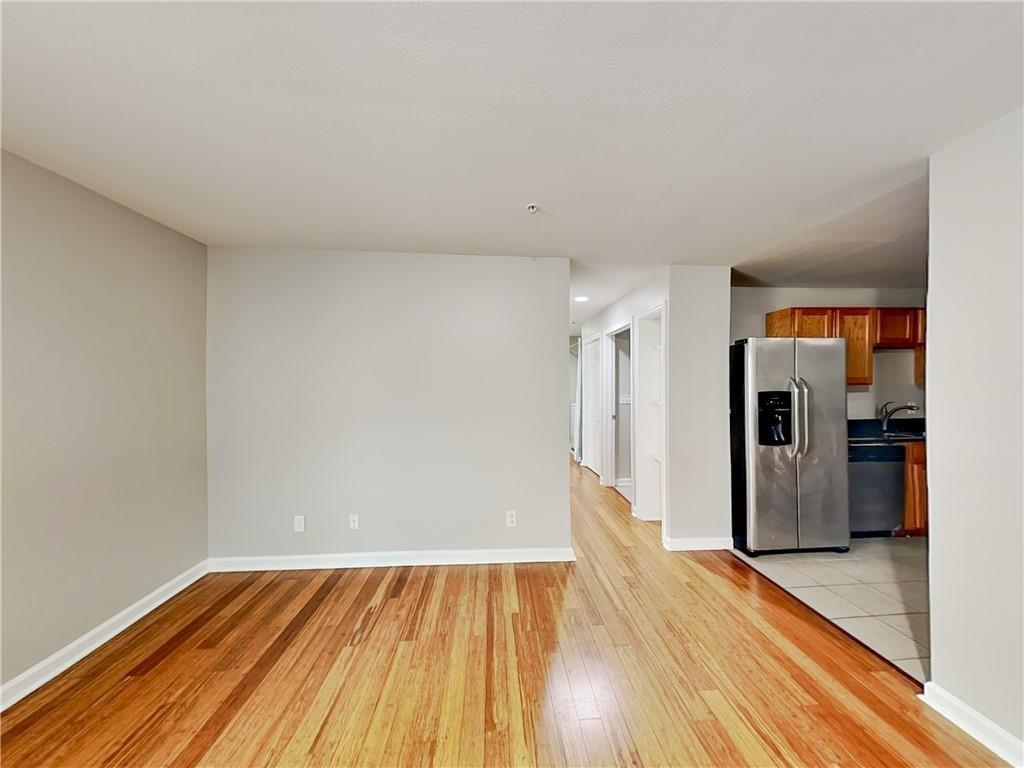 1020 Camelot Drive Atlanta, GA 30349 - Photo 3 of 17 a view of empty room with wooden floor