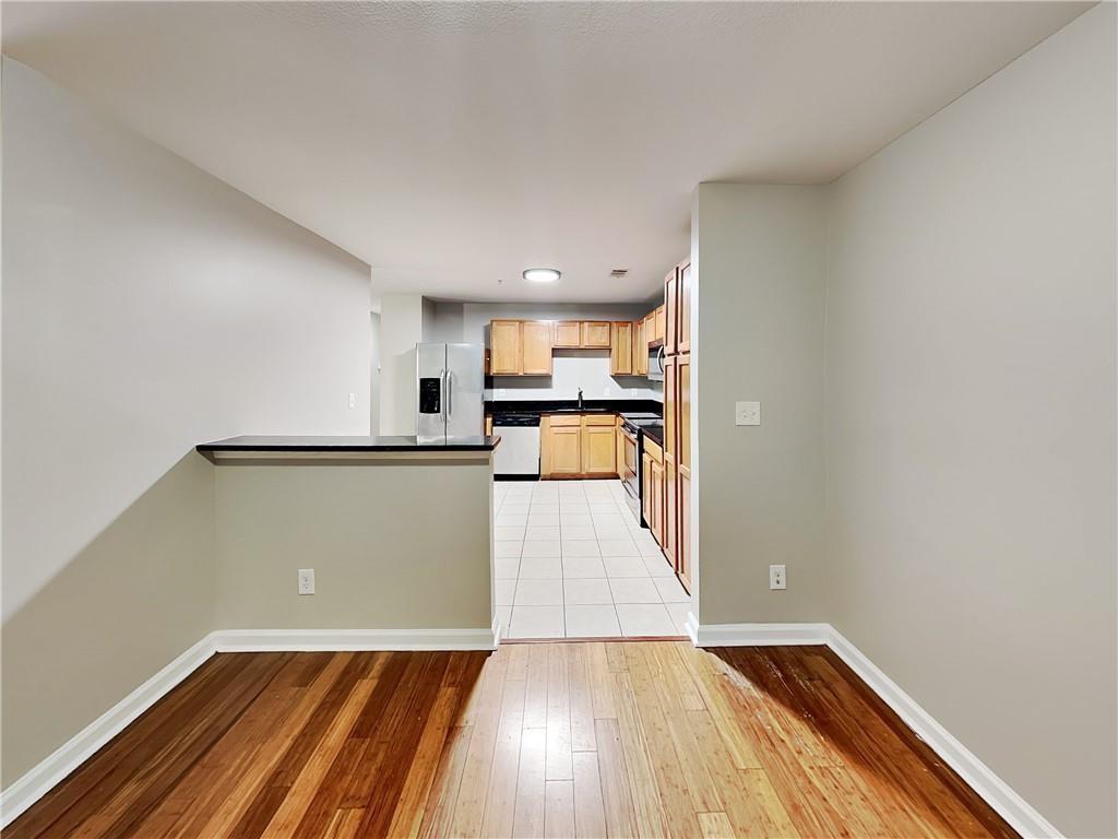 1020 Camelot Drive Atlanta, GA 30349 - Photo 6 of 17 a view of a kitchen with wooden floor and a sink