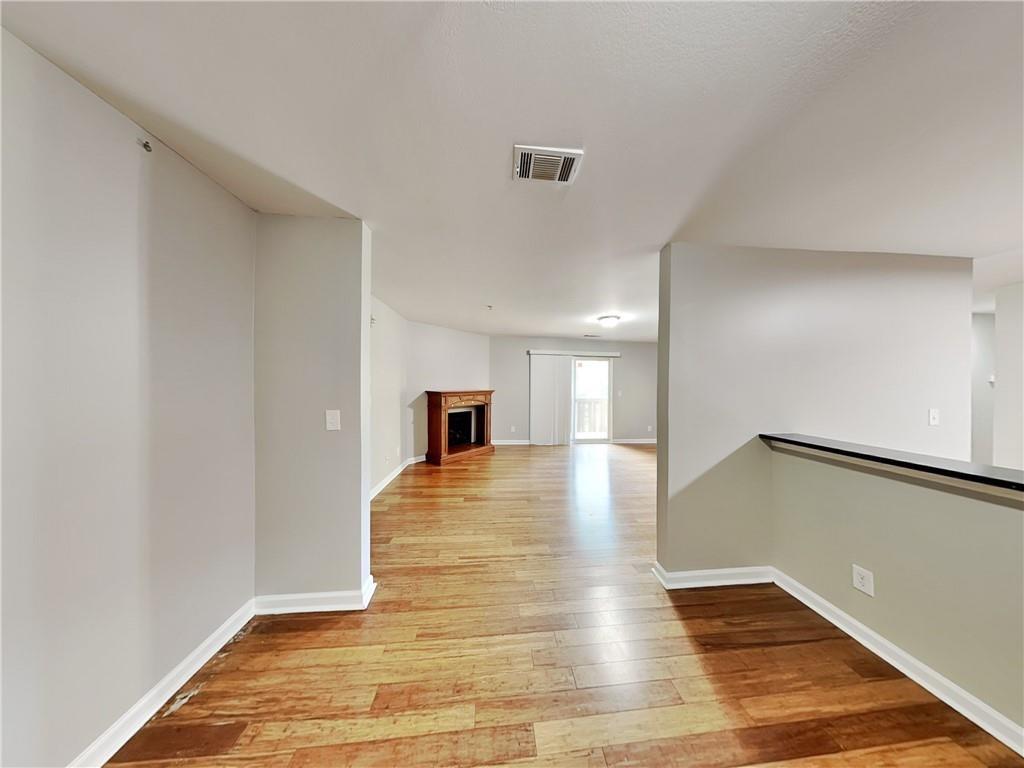 1020 Camelot Drive Atlanta, GA 30349 - Photo 7 of 17 a view of empty room with wooden floor