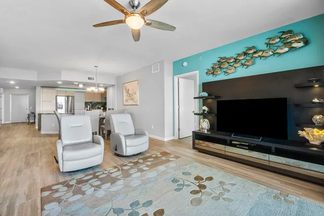 a view of kitchen with stainless steel appliances granite countertop a stove and a refrigerator