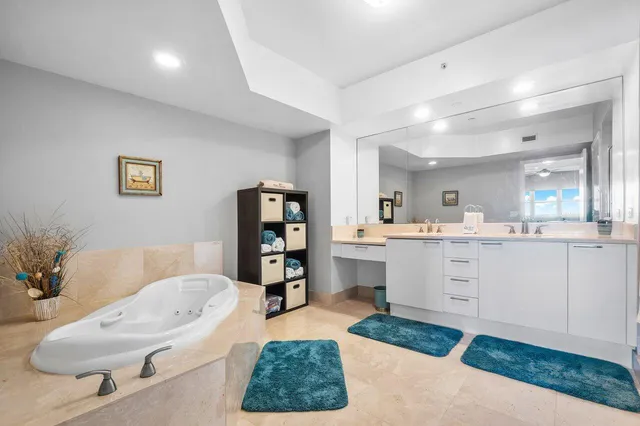 a bedroom with furniture and a flat screen tv