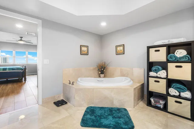 a bedroom with bed and wooden floor