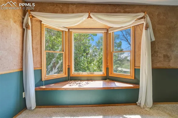 an empty room with a glass door