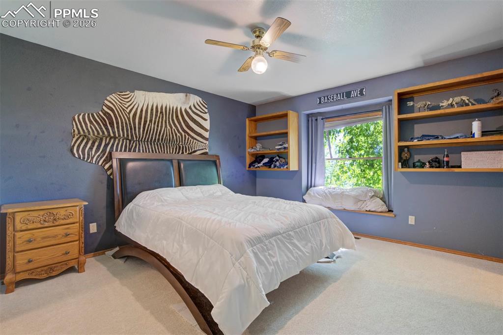 2550 Slocum Road Peyton, CO 80831 - Photo 27 of 49 a bedroom with a bed and a window