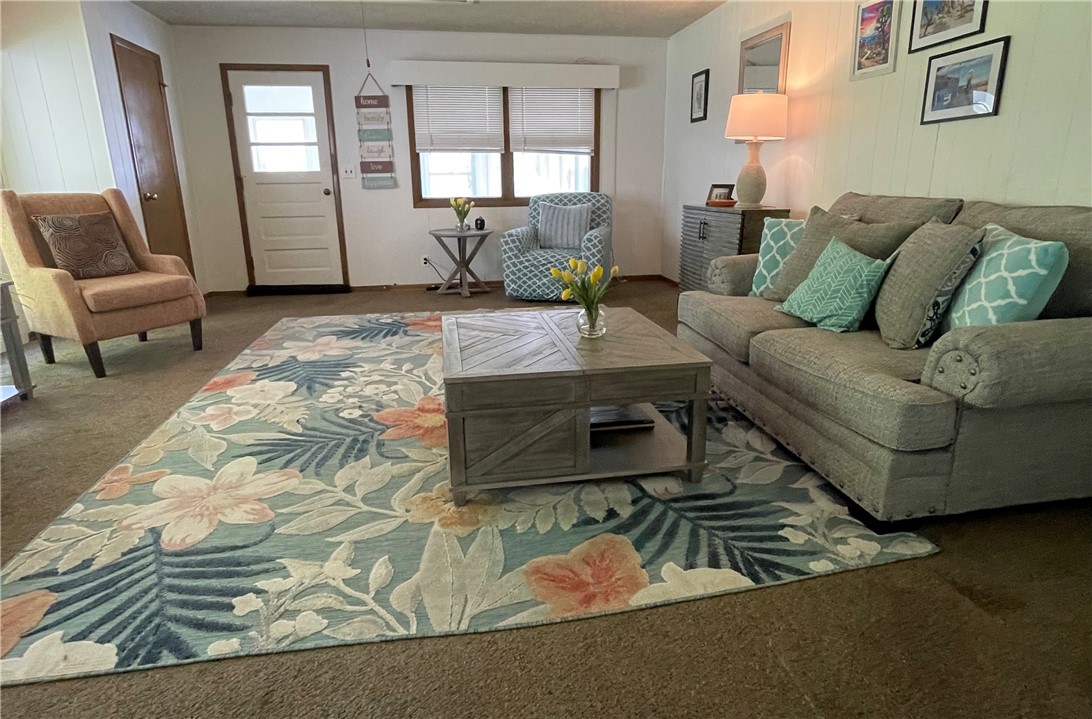 360 Ridge Street Piqua, OH 45356 - Photo 26 of 46 This inviting living room offers comfort and a sense of warmth, perfect for relaxation.