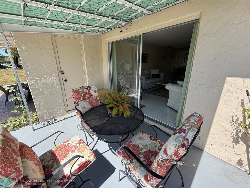8540 Chevy Chase Drive, Unit 183 Boca Raton, FL 33433 - Photo 13 of 21 a outdoor space with furniture