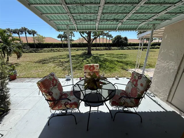 a view of swimming pool with chairs
