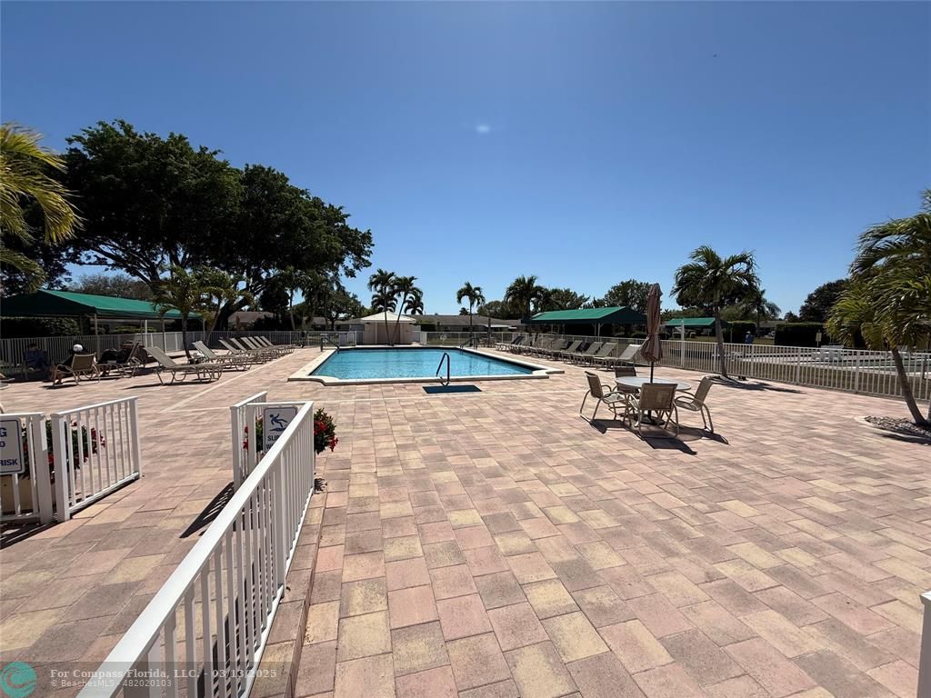 8540 Chevy Chase Drive, Unit 183 Boca Raton, FL 33433 - Photo 15 of 21 a view of swimming pool with chairs