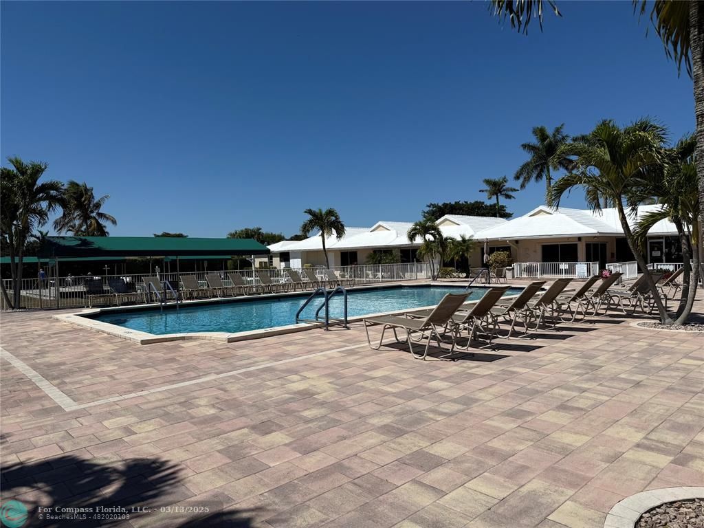 8540 Chevy Chase Drive, Unit 183 Boca Raton, FL 33433 - Photo 17 of 21 a view of a chairs and tables on the roof deck