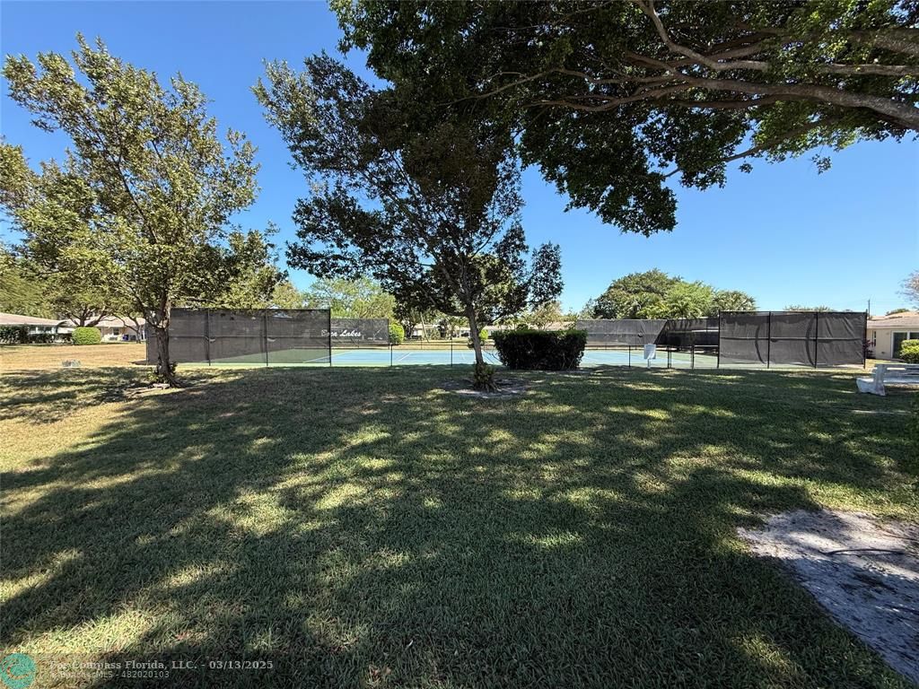 8540 Chevy Chase Drive, Unit 183 Boca Raton, FL 33433 - Photo 21 of 21 a view of outdoor space with garden view