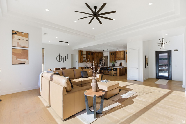 2197 Reserve Circle St. George, UT 84770 - Photo 14 of 57 Living area featuring ceiling fan, light wood finished floors, and recessed lighting