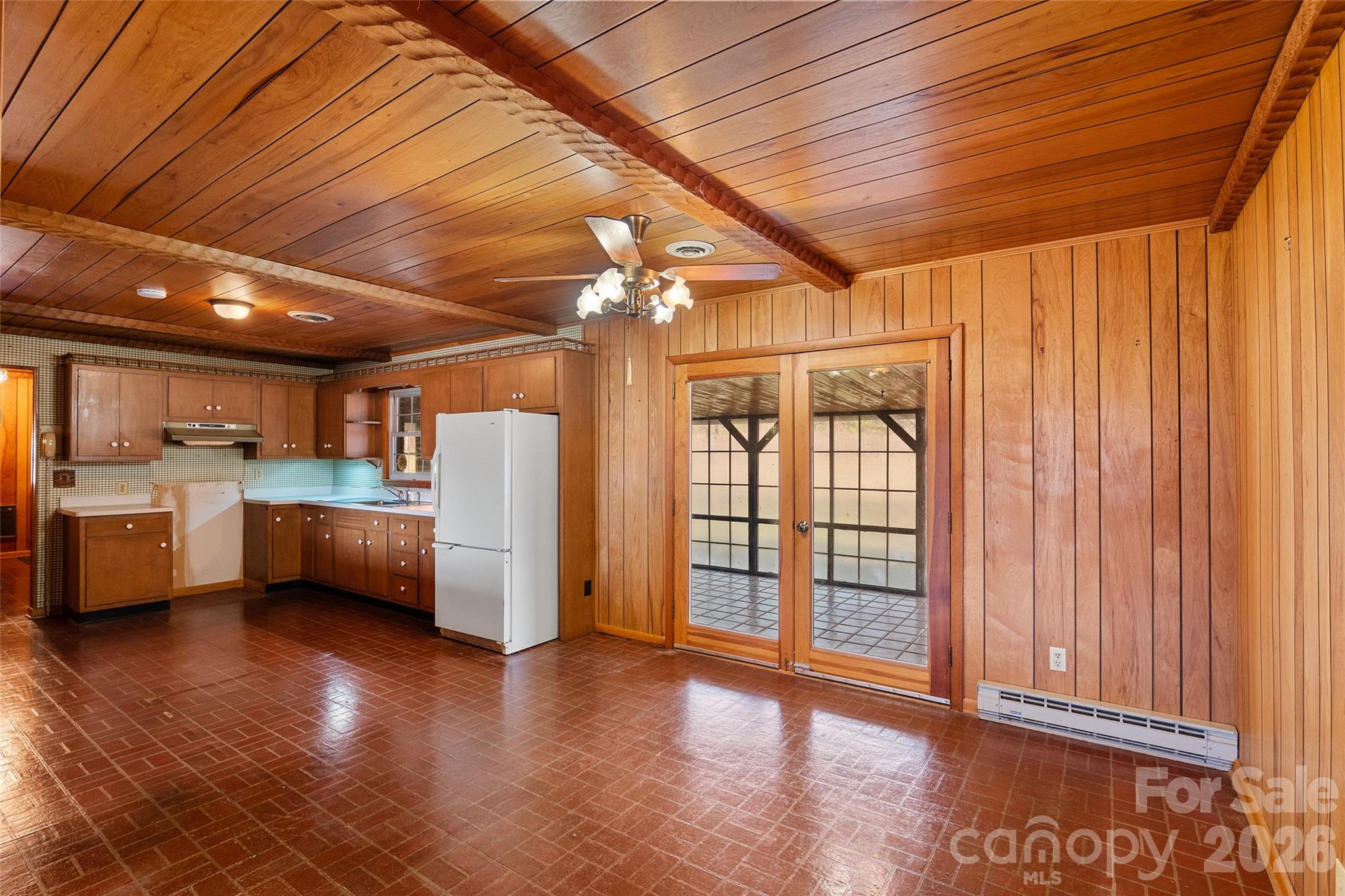 591 Landrum Road Tryon, NC 28782 - Photo 19 of 48 a view of a kitchen with furniture and a window