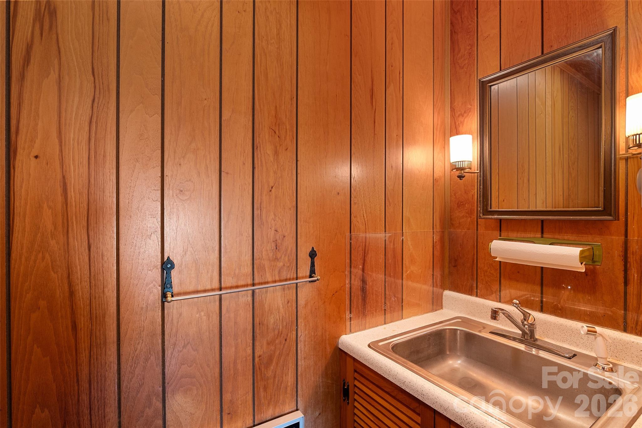 591 Landrum Road Tryon, NC 28782 - Photo 25 of 48 a bathroom with a sink and a mirror