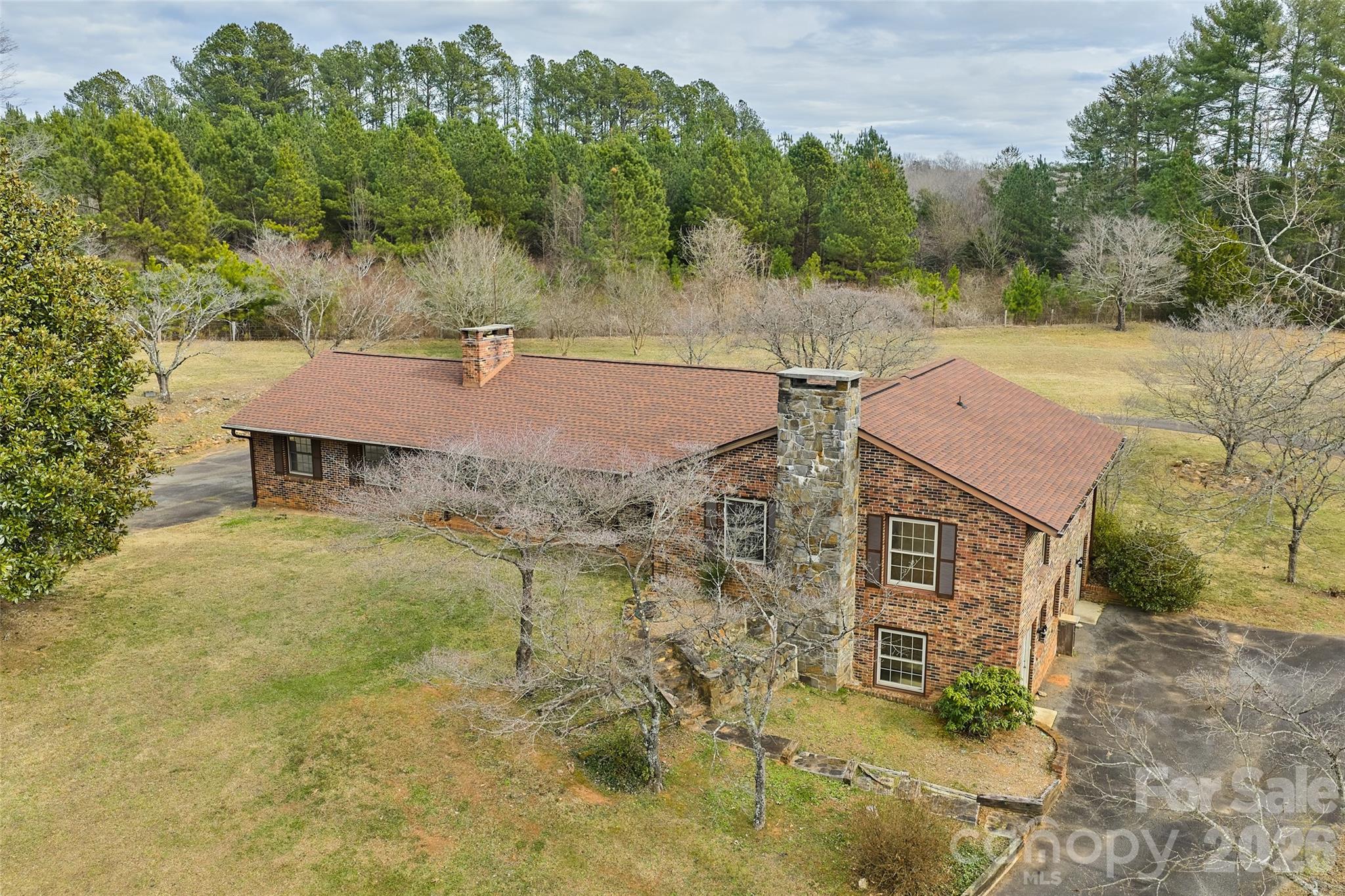 591 Landrum Road Tryon, NC 28782 - Photo 42 of 48 an aerial view of a house with a yard