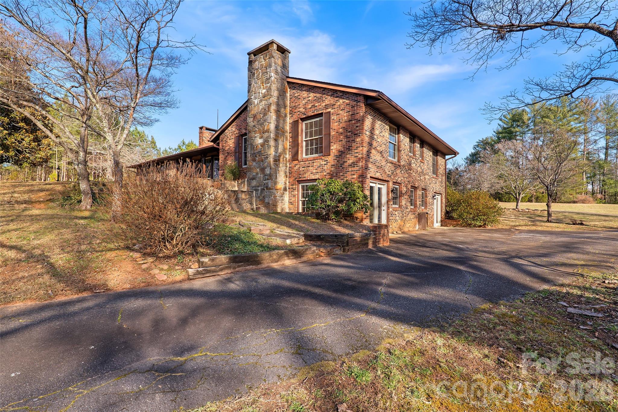 591 Landrum Road Tryon, NC 28782 - Photo 43 of 48 a front view of a house with a yard
