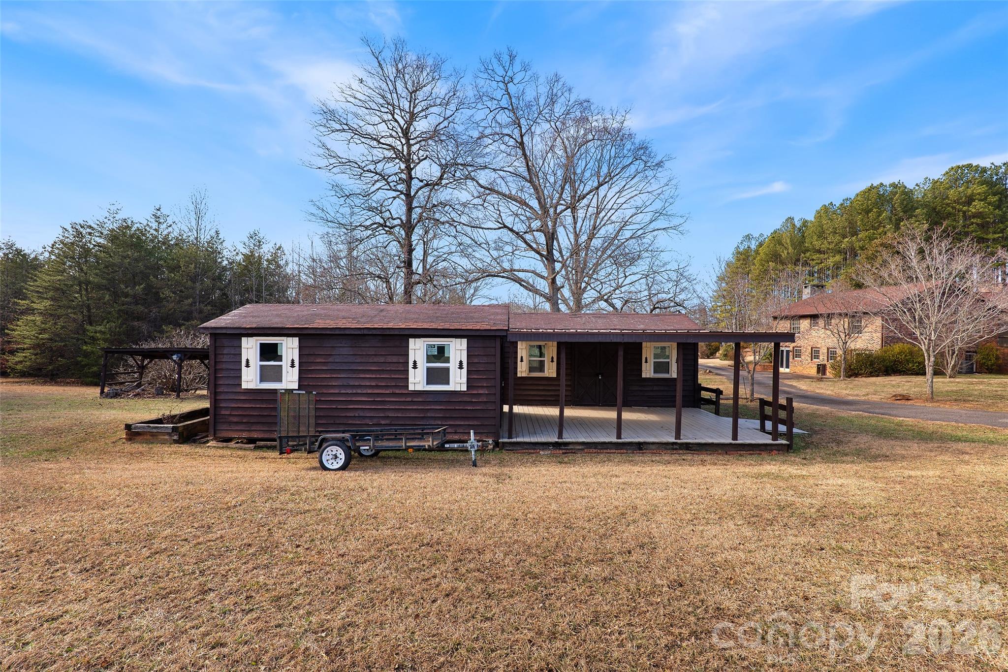 591 Landrum Road Tryon, NC 28782 - Photo 7 of 48 a view of a house with a yard covered in snow