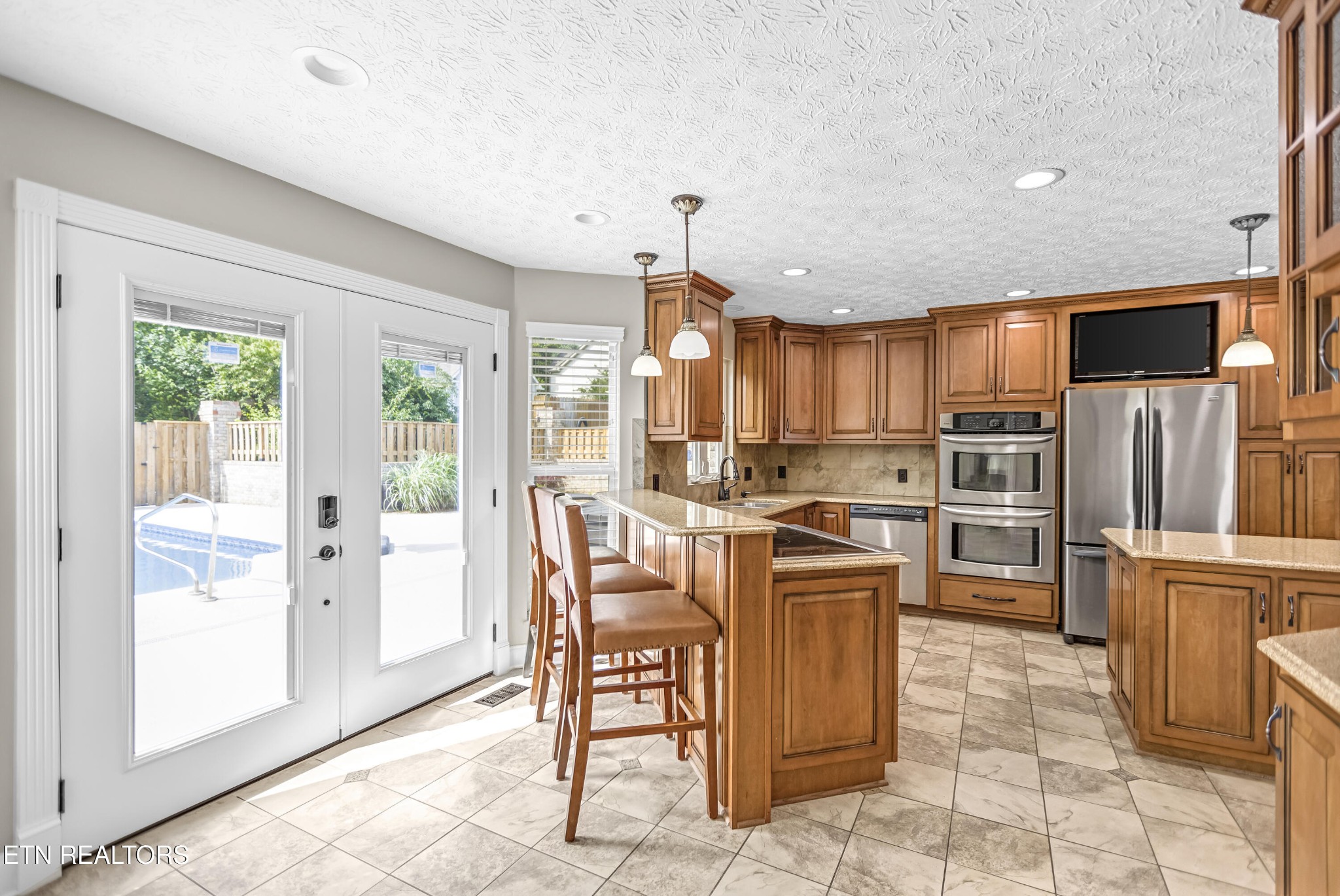 117 Mayview Drive Powell, TN 37849 - Photo 11 of 56 a kitchen with refrigerator a stove a sink and a dining table