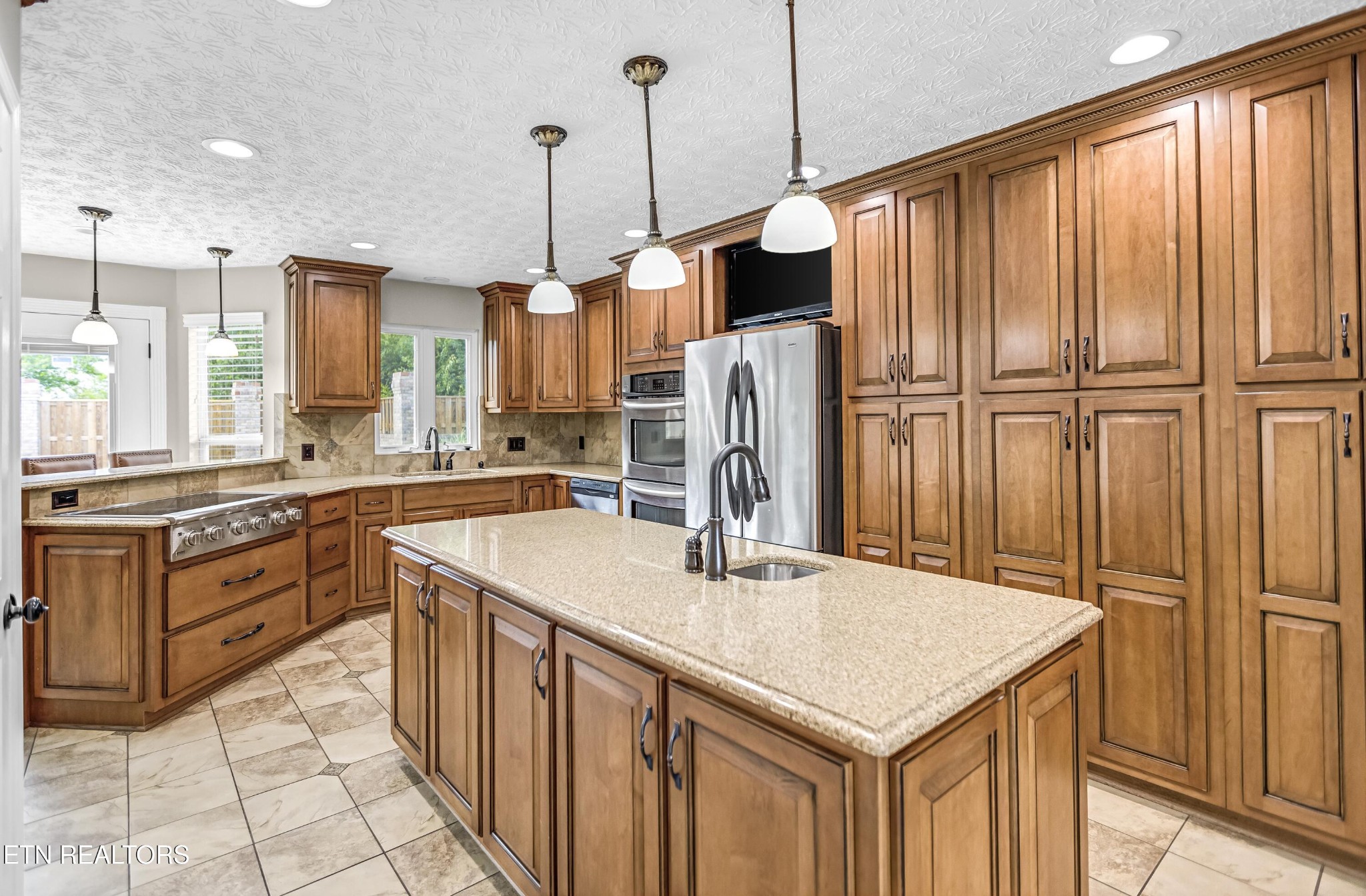 117 Mayview Drive Powell, TN 37849 - Photo 12 of 56 a kitchen with stainless steel appliances granite countertop a sink a stove and a refrigerator