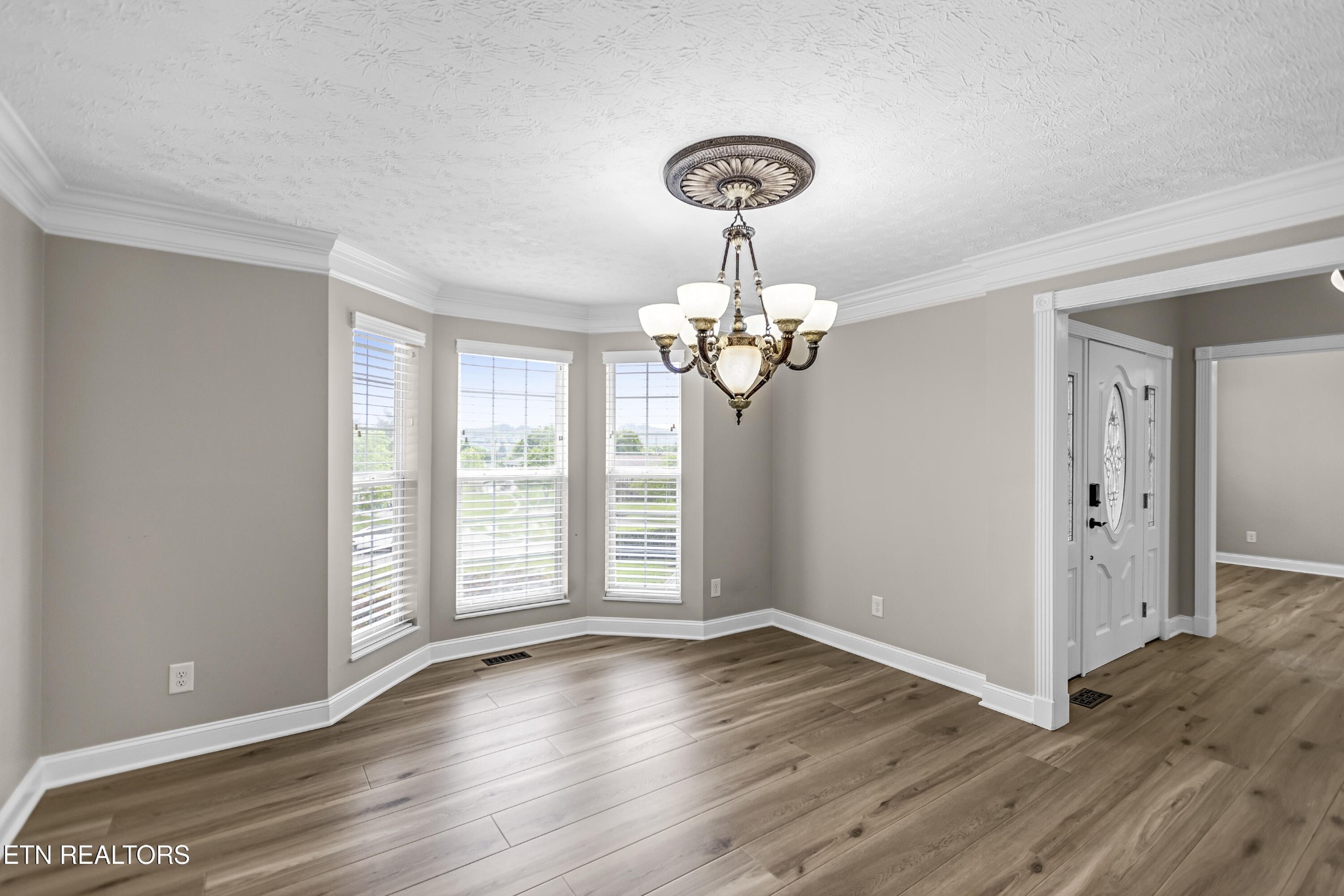 117 Mayview Drive Powell, TN 37849 - Photo 16 of 56 a view of an empty room with wooden floor and a window