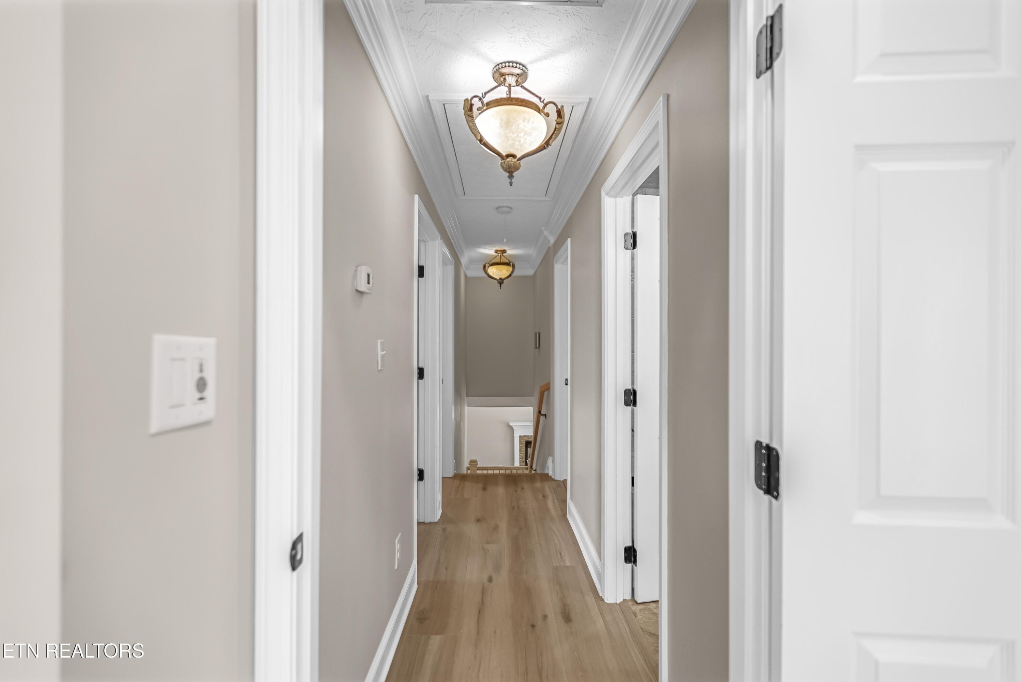 117 Mayview Drive Powell, TN 37849 - Photo 18 of 56 a view of a hallway with wooden floor and a chandelier