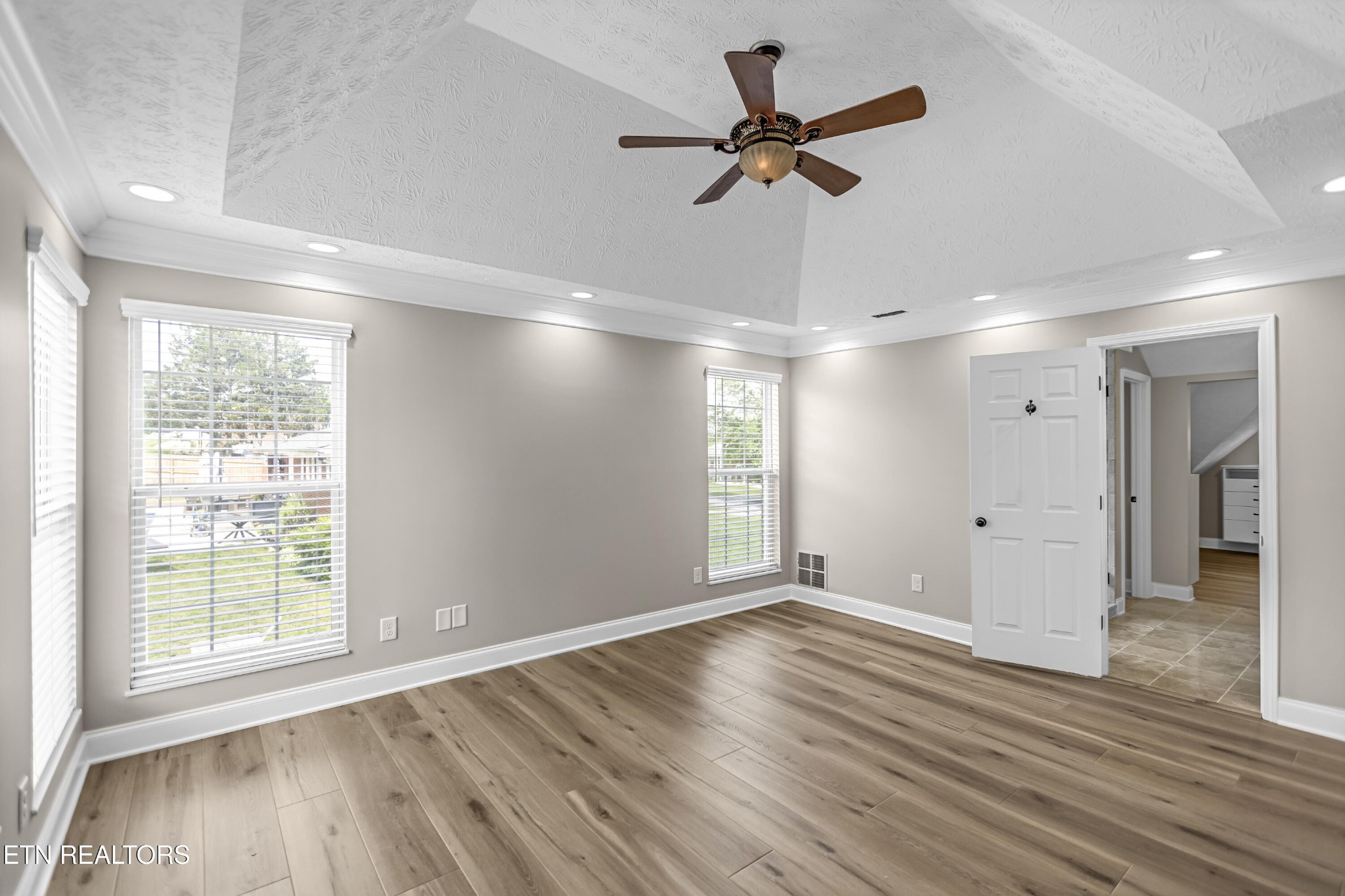 117 Mayview Drive Powell, TN 37849 - Photo 19 of 56 a view of empty room with wooden floor and fan