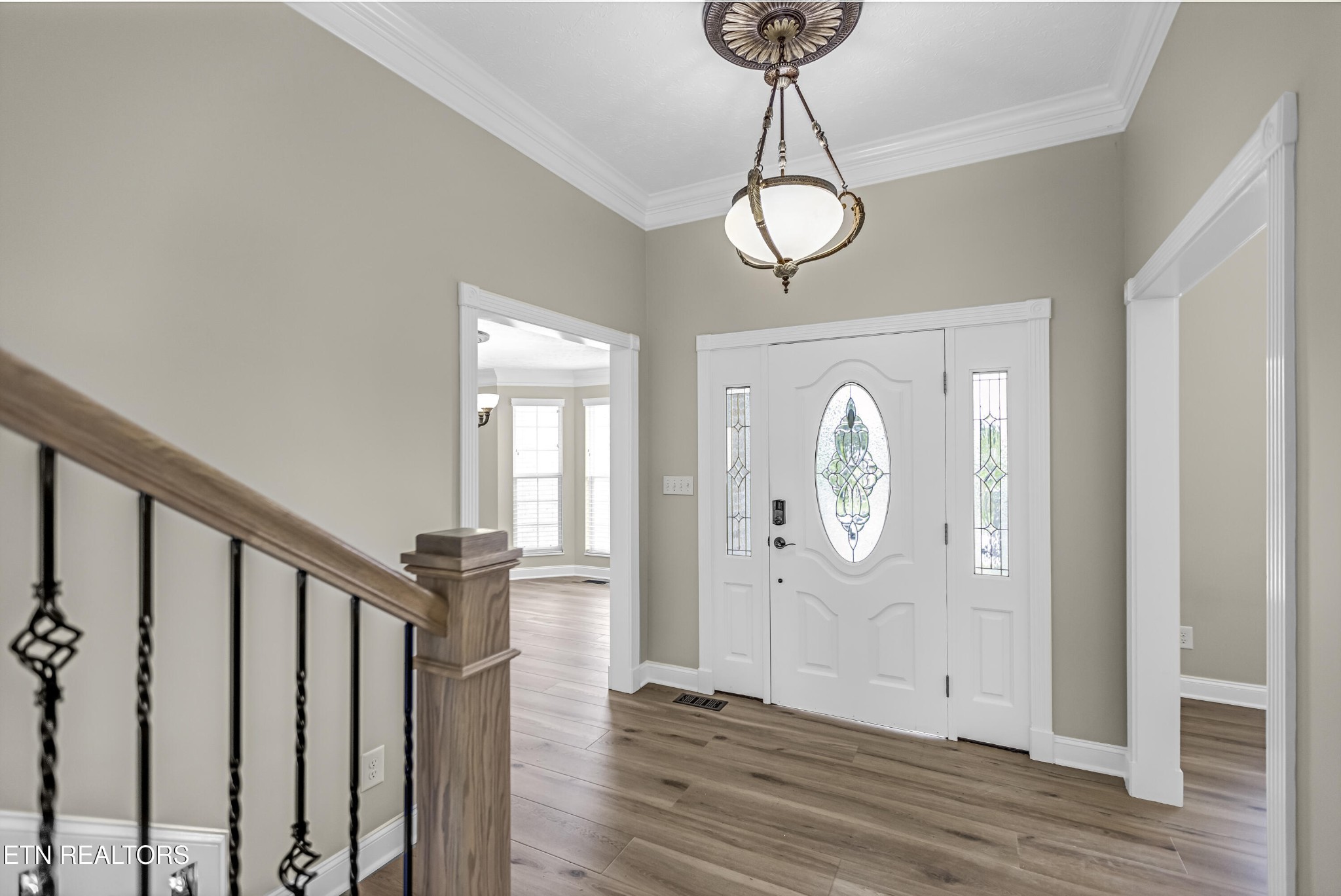 117 Mayview Drive Powell, TN 37849 - Photo 2 of 56 a view of a hallway with wooden floor and front door