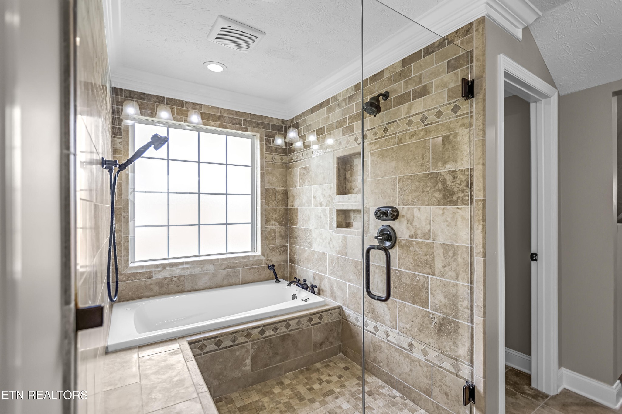 117 Mayview Drive Powell, TN 37849 - Photo 21 of 56 a bathroom with a shower and a bathtub