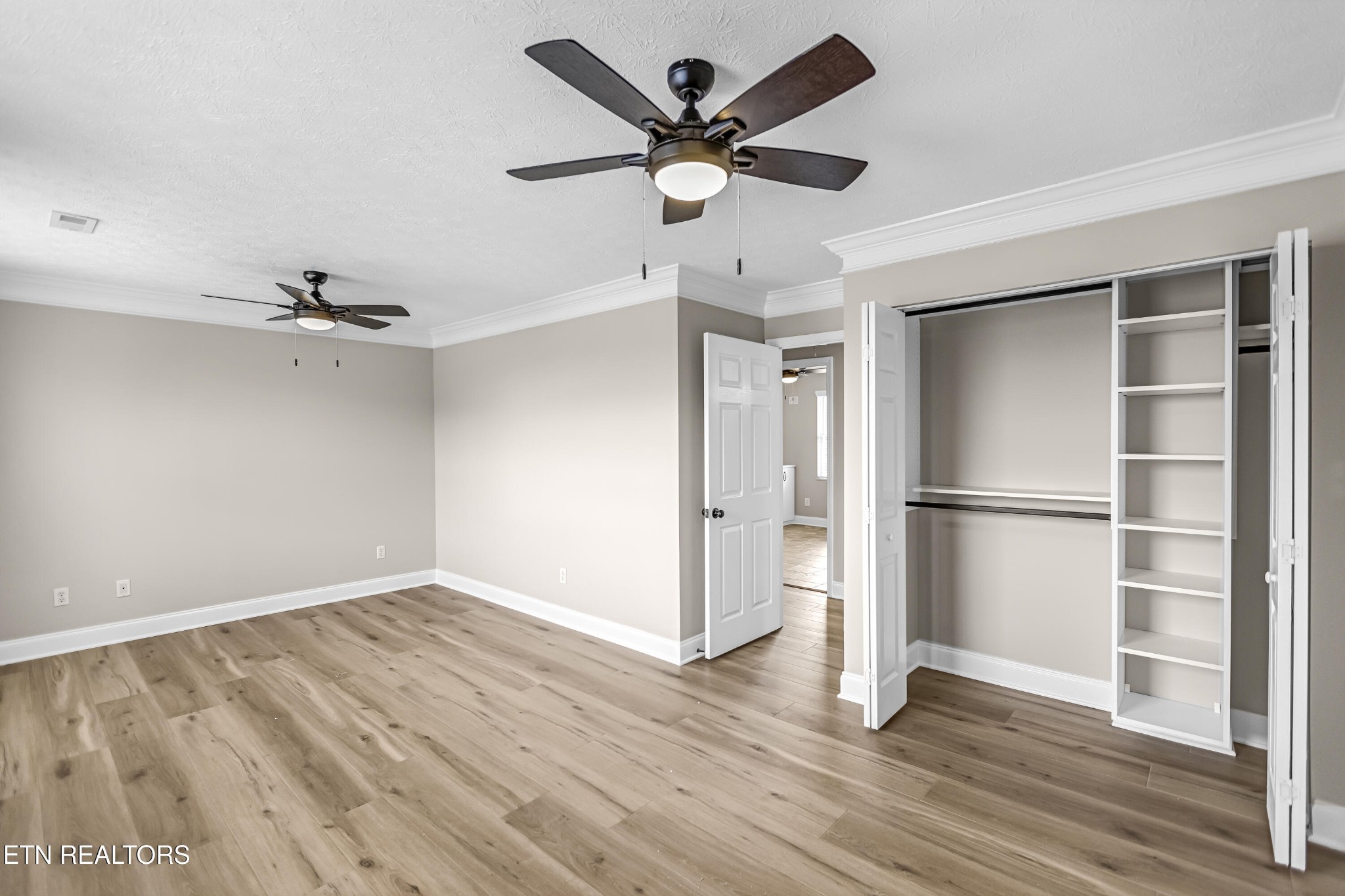 117 Mayview Drive Powell, TN 37849 - Photo 25 of 56 a view of an empty room with wooden floor