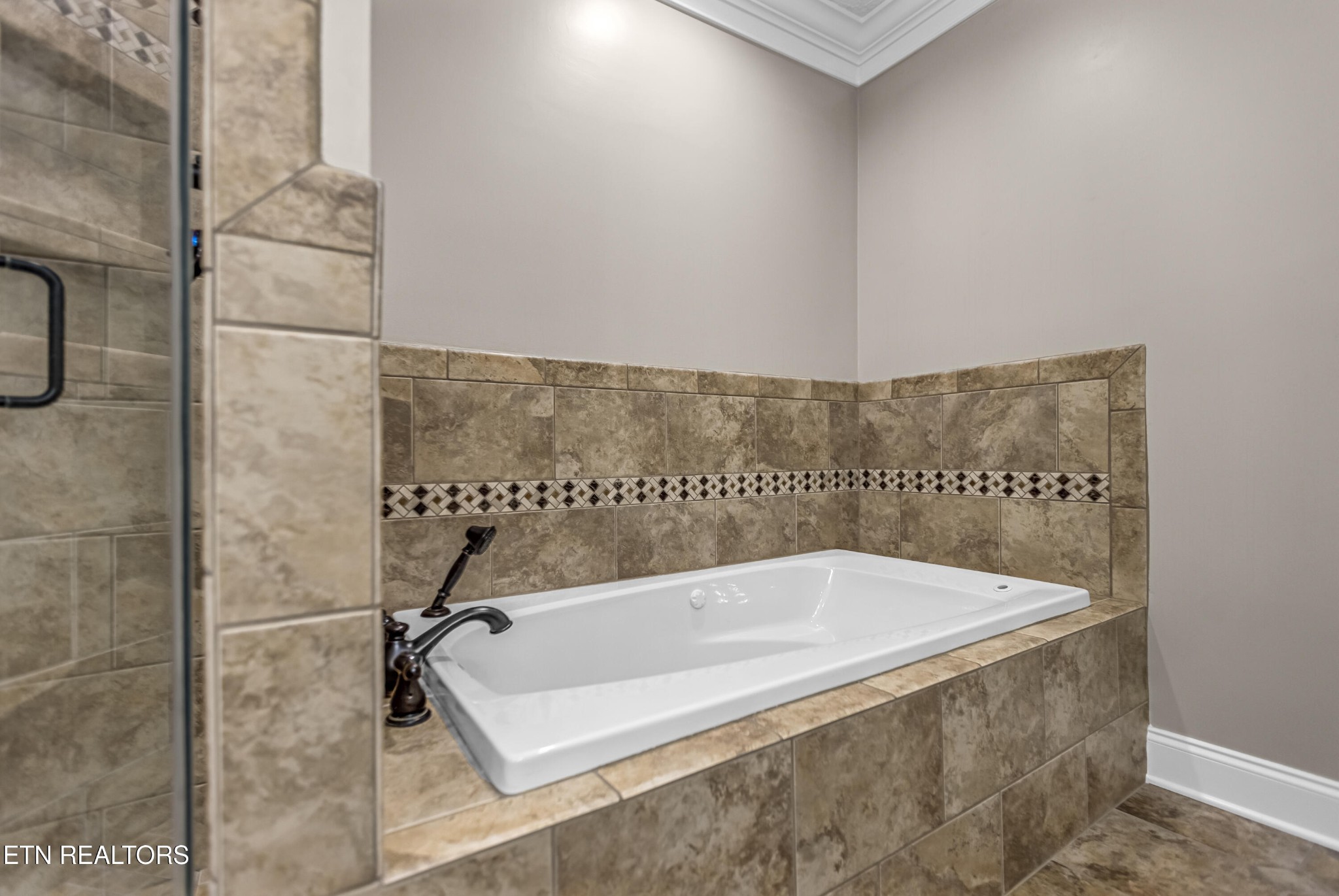 117 Mayview Drive Powell, TN 37849 - Photo 27 of 56 a bathroom with a bathtub and shower