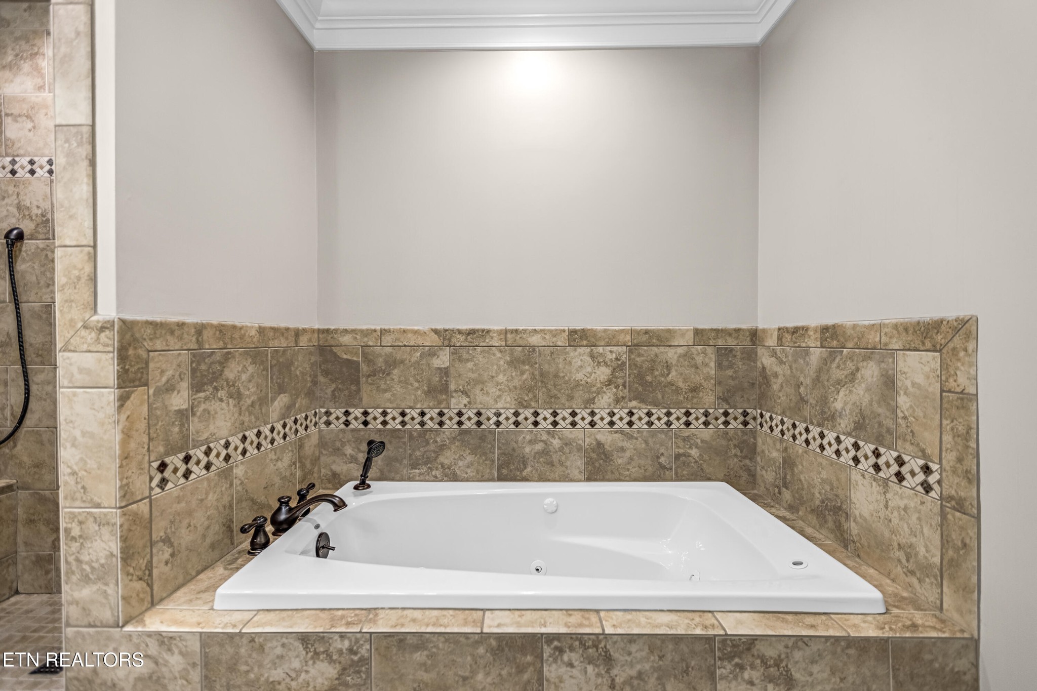 117 Mayview Drive Powell, TN 37849 - Photo 28 of 56 a bathroom with a bathtub and shower