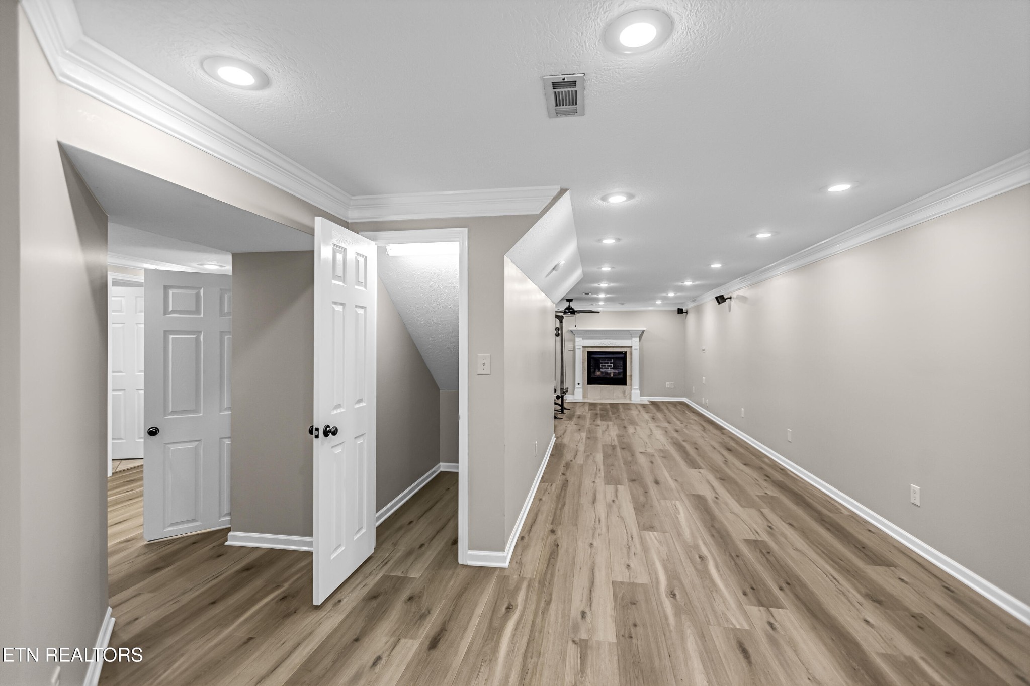 117 Mayview Drive Powell, TN 37849 - Photo 35 of 56 a view of a hallway with wooden floor and staircase
