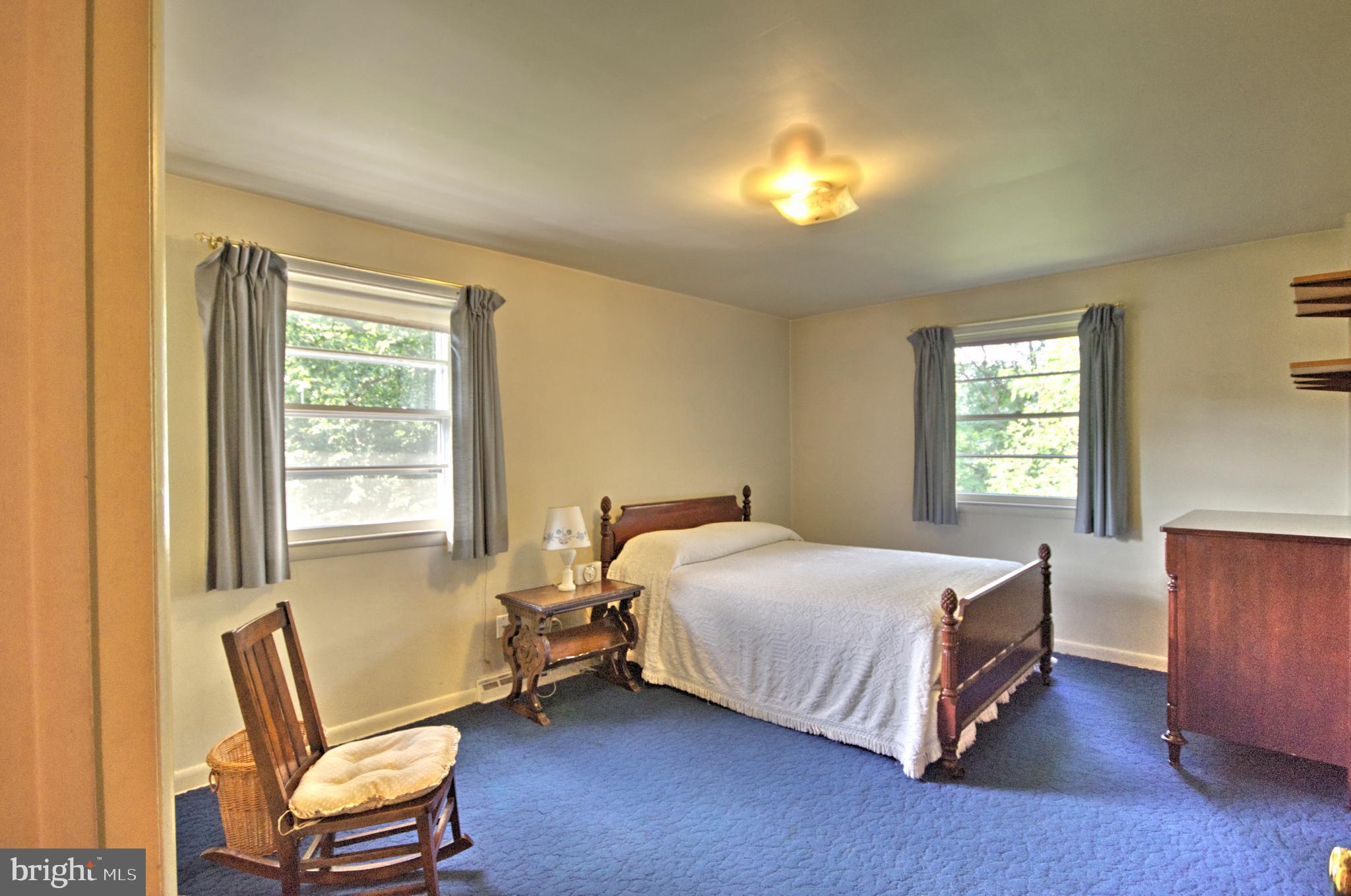 683 Mallard Road Wayne, PA 19087 - Photo 14 of 16 a bedroom with a bed and a window