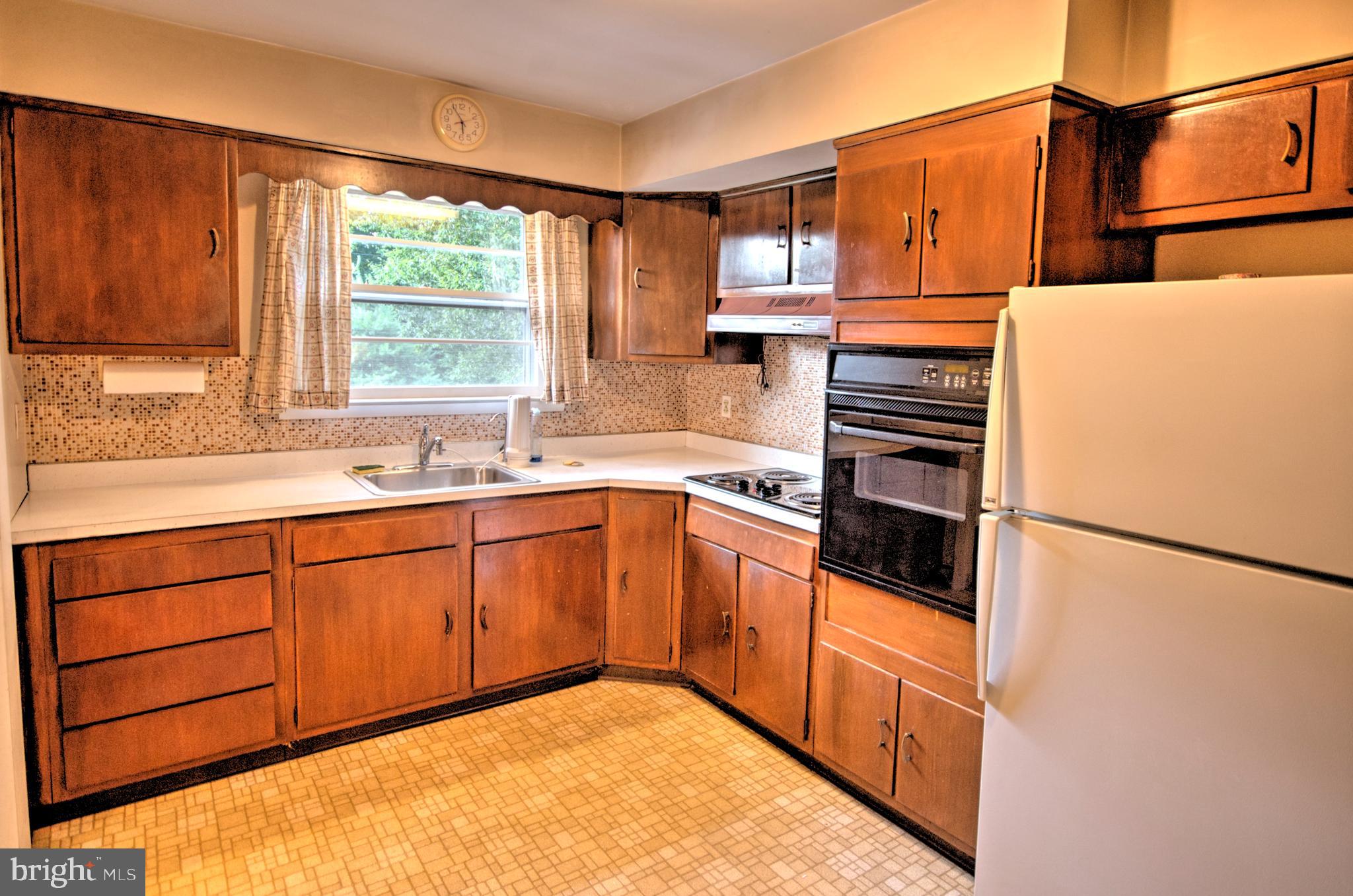 683 Mallard Road Wayne, PA 19087 - Photo 4 of 16 a kitchen with stainless steel appliances granite countertop a refrigerator sink and cabinets