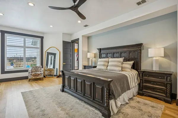 a bedroom with a bed couch and a window