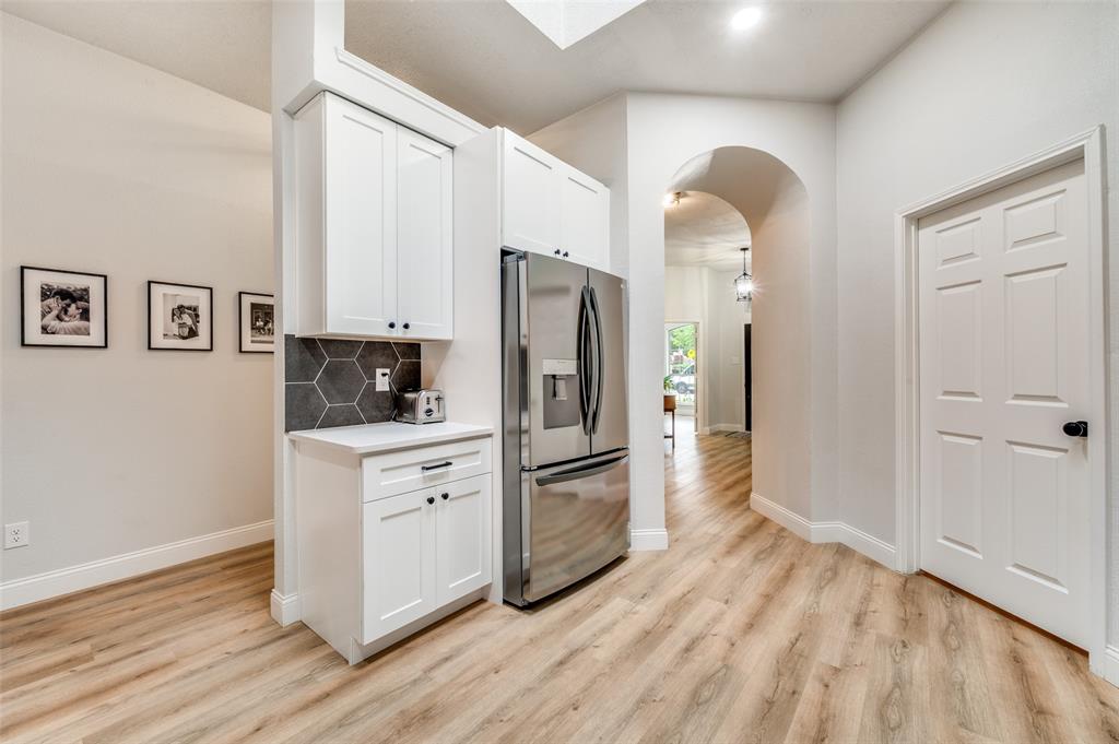 7306 Vista Ridge Lane Sachse, TX 75048 - Photo 6 of 23 a kitchen with stainless steel appliances granite countertop a refrigerator and a stove top oven